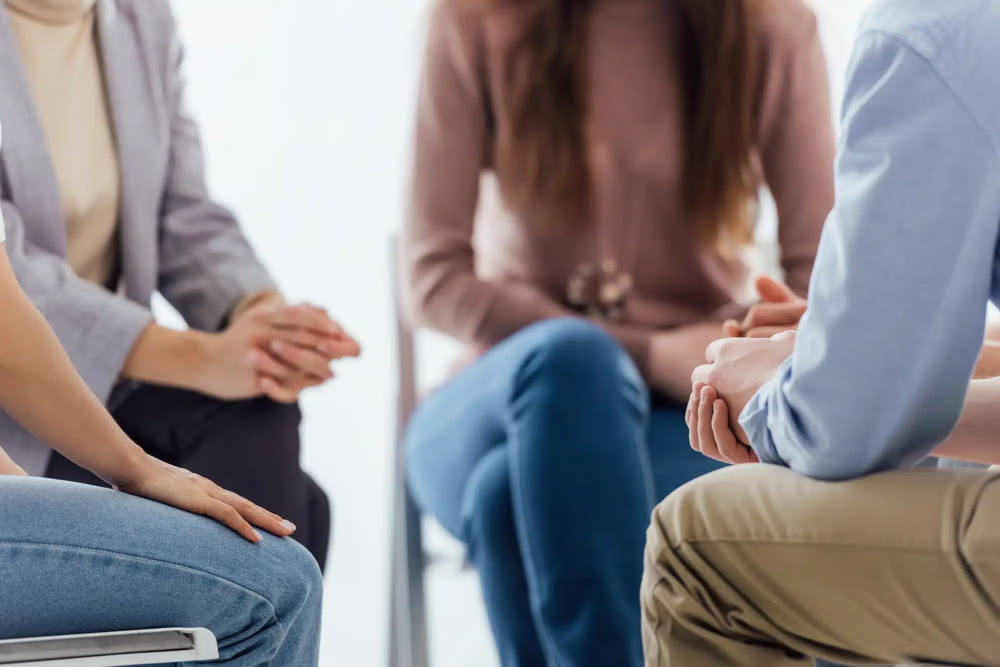 cropped view of people sitting during group therapy session